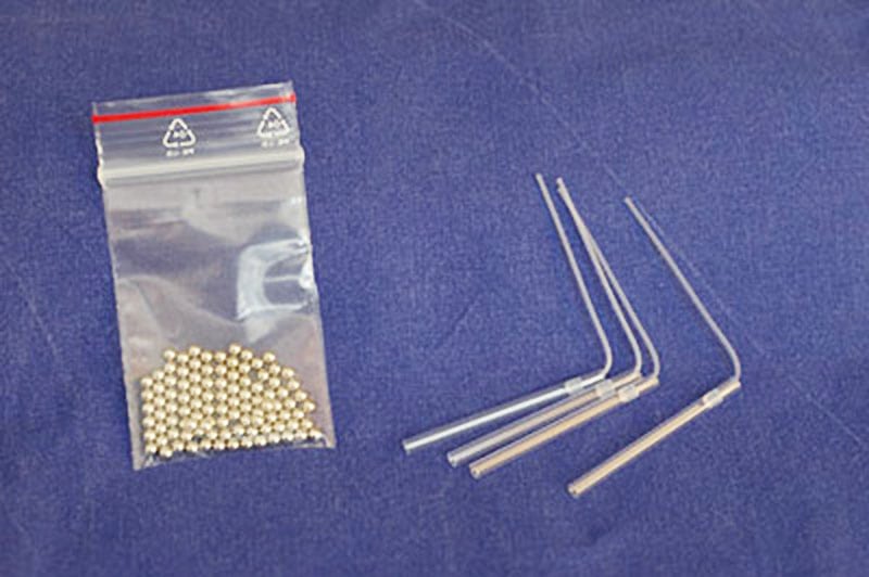 Straws (plastic stems) like these are used to freeze 1 - 3 egg cells. The straws are sealed with a steal ball or ideally by welding the end together.